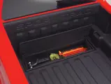 Ford Sport Trac Adrenalin teaser: Adrenalin's composite bed features a storage box (open) integrated into the load floor.