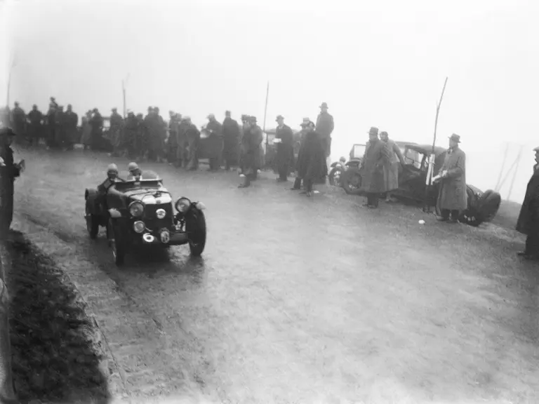 With his wife as co-driver, Eddie Hall competes in the Works-entered MG K3 Magnette at the 1934 Mille Miglia.