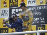 Michael Schumacher and Nigel Mansell celebrate atop the podium after the 1992 Spanish Grand Prix.