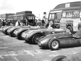 The Connaught alongside the rest of the Ecurie Ecosse team at the British GP Meeting in 1953.