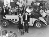 Mr. and Mrs. Prost stand with the Delage after winning the Mougins concours d'elegance in the 1970s.