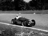 Stirling Moss behind the wheel of the Connaught at the 1952 Italian Grand Prix at Monza.