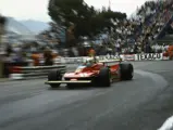 Flying round the Monegasque bends, Jody Scheckter drives the Ferrari 312T (numbered 11) to claim outright victory in the 1979 Monaco Grand Prix.