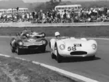 The Cooper-Jaguar tries to fend off a pair of Ecurie Ecosse D-Types at Goodwood in April 1956.