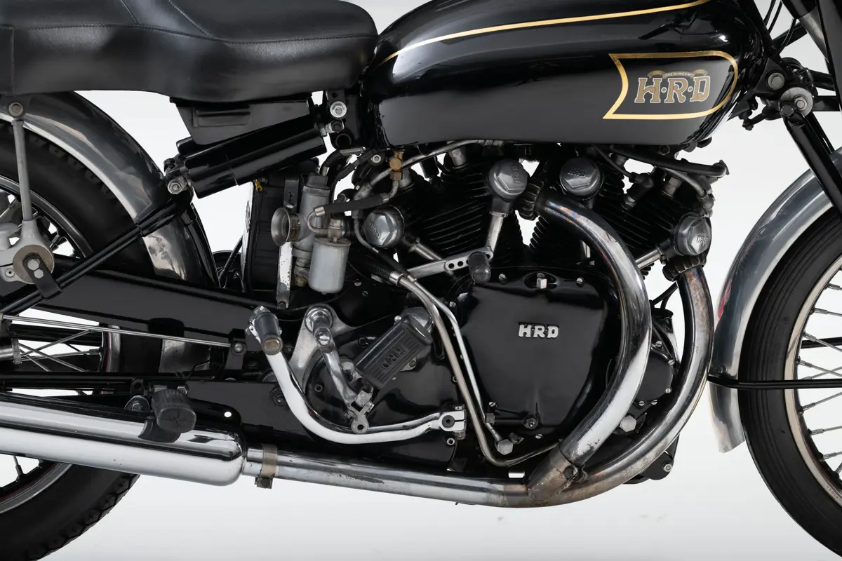 A closeup of the right side of the Vincent HRD Black Shadow and its engine. You can see the kickstart peg folded neatly into the side of the engine casing, which bears H-R-D