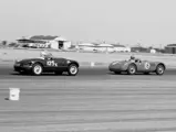 The Vignale-bodied Ferrari 166 (0342 M) piloted by Bill Louden chasing XKC 007 at Bakersfield in May of 1956.