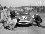 The E-Type is examined in the pits at Lordelo Ouro in 1962.
