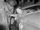Gianni Marzotto interacts with the crowd at the start prior to the 1951 Mille Miglia.