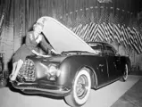 Chrysler engineer Lucille Pieti makes last minute adjustments on the new Chrysler D'Elegance at the Easter Parade of Stars at the Waldorf-Astoria in New York.