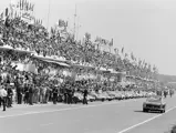 The Ferrari is captured driving along the grid prior to the start of the 1963 24 Hours of Le Mans.