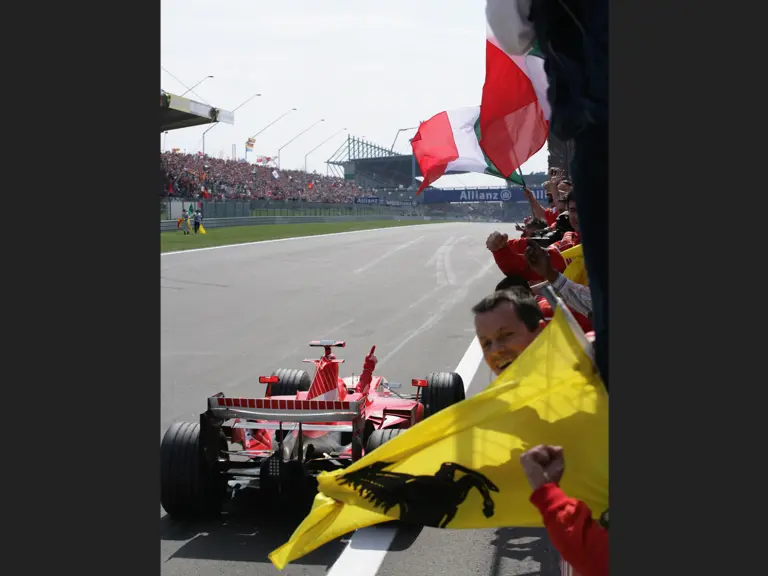 Michael Schumacher celebrates his win at the 2006 European Grand Prix.