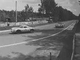 Chassis 550A-0104 (car no. 25) leads a Porsche 356 A (car no. 34) into a turn at the 24 Hours of Le Mans, 1956.