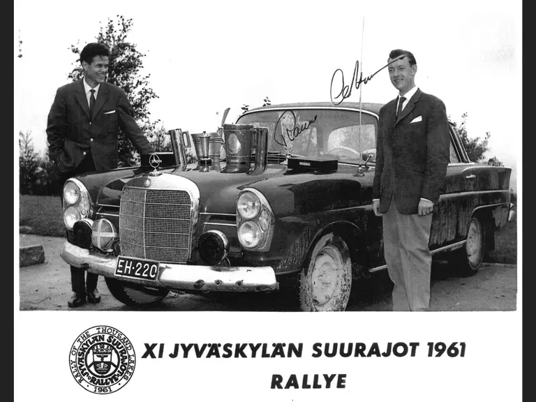 Aaltonen poses with silverware following a stunning victory in the 1961 Rally of the 1000 Lakes.