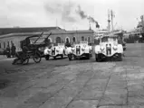Three of the team cars for the NSKK ready for shipping at an Italian Harbour prior to the desert race “Corsa Sulla Litoranea,” 1939.