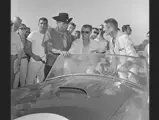 Carroll Shelby, Bob Holbert, and Ken Miles celebrate their class win at Road America in CSX 2129, September 1963.