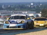 Seen here leading a Corvette C5-R, the 911 GT3 R climbed from 42nd to finish 17th overall at the 2000 24 Hours of Le Mans.