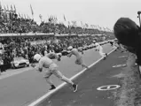 Briggs Cunningham (foreground) sprints across the track to #1, while Dick ‘The Flying Dentist’ Thompson (#2) and John Fitch (#3) follow suit.
