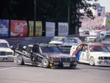 Schenider wore race number “4” as he is captured here trying to overtake Roberto Ravaglia’s BMW M3 Sport Evolution in the 190 E 2.5-16 Evolution II at the Noisring Nürnberg on 28 June 1992. 