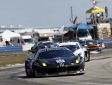 Ferrari 458 GTD #555 from AIM Autosports competes at the 2014 Sebring 12 Hours.
