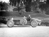 Lord Cholmondeley pictured with his Bugatti shortly after delivery in 1925 (note the temporary French registration plates).