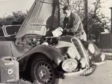 The second owner, Morgens Skarring, is seen here topping up chassis 74308’s oil at the 1950 Tulpen Rally in Holland. Courtesy of the owner.