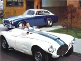 Briggs Cunningham poses outside of Alfred Momo’s facilities in 1952 with chassis 5208 in the background.