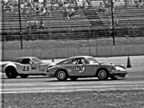 10 June 1973; IMSA Camel GT Championship Round 3, the 500 Miles of Pocono International Raceway; Niederer and his #97 GTU-class 911 Rally lead the #77 GTU-class 911 S of Bruce Jennings and #1 GTO-class Carrera RSR of Michael Keyser into a Porsche-themed battle approaching the Tunnel Curve.