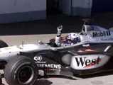 David Coulthard celebrates winning the 2001 Austrian Grand Prix.