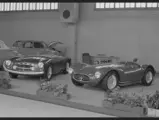 In a display that encompassed both the grand touring and competition sensibilities that Modena was capable of embracing, chassis number 2101 (left) is exhibited on Maserati’s stand at the 1955 Geneva Salon, sitting beside an A6GCS racing barchetta.  This early photo notably showcases the A6G/54’s unusual original grille work.