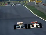 Nigel Mansell in his Williams FW14 battles wheel to wheel with Ayrton Senna in his McLaren MP4/6 to lead the 1991 Spanish Grand Prix.