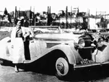 The winner of the 1936 L'Elegance Automobile, posed at Cannes with Madame Lartique.