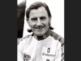 Graham Hill wearing an Embassy Racing suit, like the one on offer.