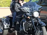 Johnny Hallyday and his wife Laeticia on their Harley-Davidson in Malibu, California in 2011.