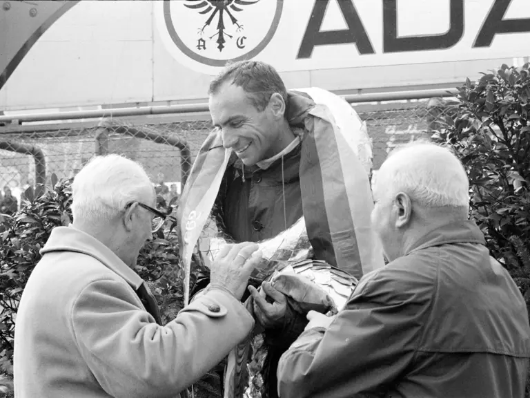 NüRBURGRING, GERMANY - MAY 27: Willy Mairesse, 2nd position, on the podium during the Nurburgring 1000 kms at Nürburgring on May 27, 1962 in Nürburgring, Germany. (Photo by Rainer Schlegelmilch)