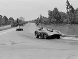 Fangio piloting 0598 CM into a turn ahead of the other Scuderia Ferrari entry at the 1956 1000 KM Buenos Aires.