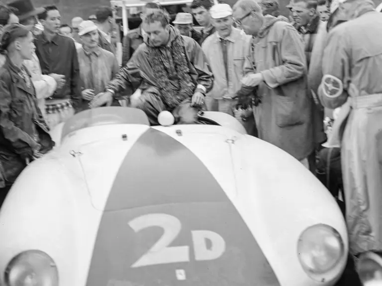 Phil Hill celebrates his success atop the 750 Monza following his win at the Del Monte Trophy Race at Pebble Beach in 1955.