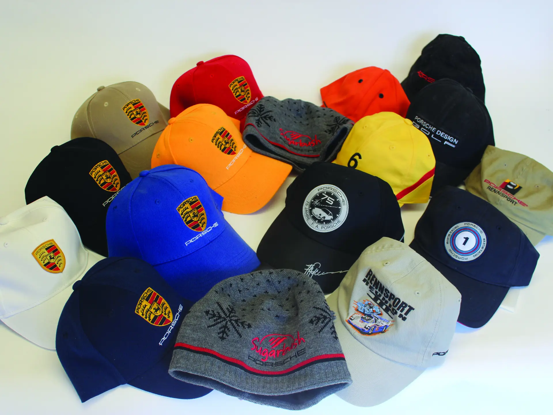 A collection of 17, new, Porsche and Porsche Design hats. | Fort ...