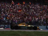 Michael Schumacher waves to the crowds after his first home Grand Prix at Hockenheim, Germany in July of 1992.
