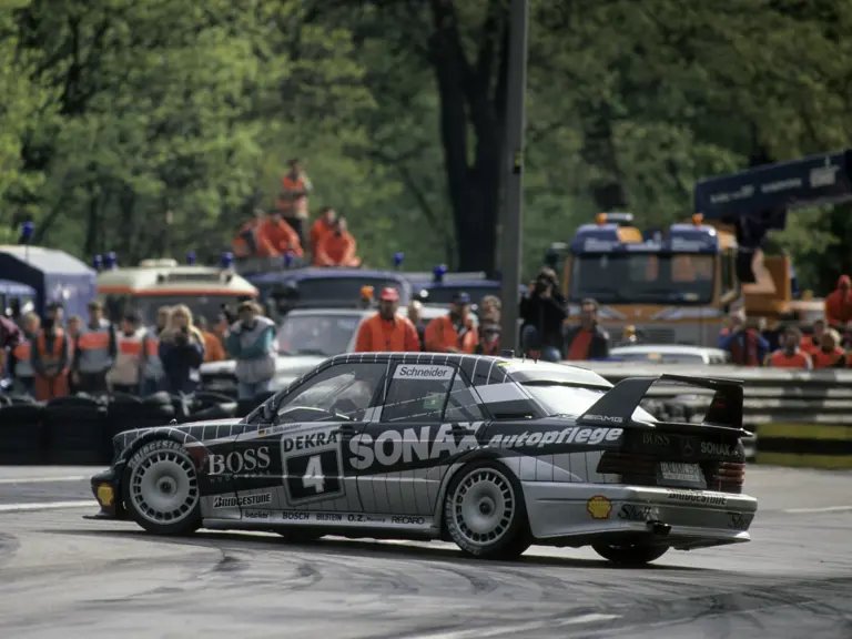 Bernd Schneider deftly slides his Mercedes-Benz 190 E 2.5-16 Evolution II around the Südkurve hairpin at the ADAC Avus on 8th May in the 1992 Deutsche Tourenwagen Meisterschaft.