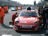 The Porsche is readied on the grid at Monza for a race in 1997.