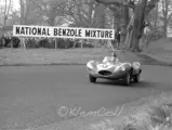 The #55 D-Type powers up the hill and past the crowds at the British Empire Trophy Meeting, Oulton Park, 6 April 1957.
