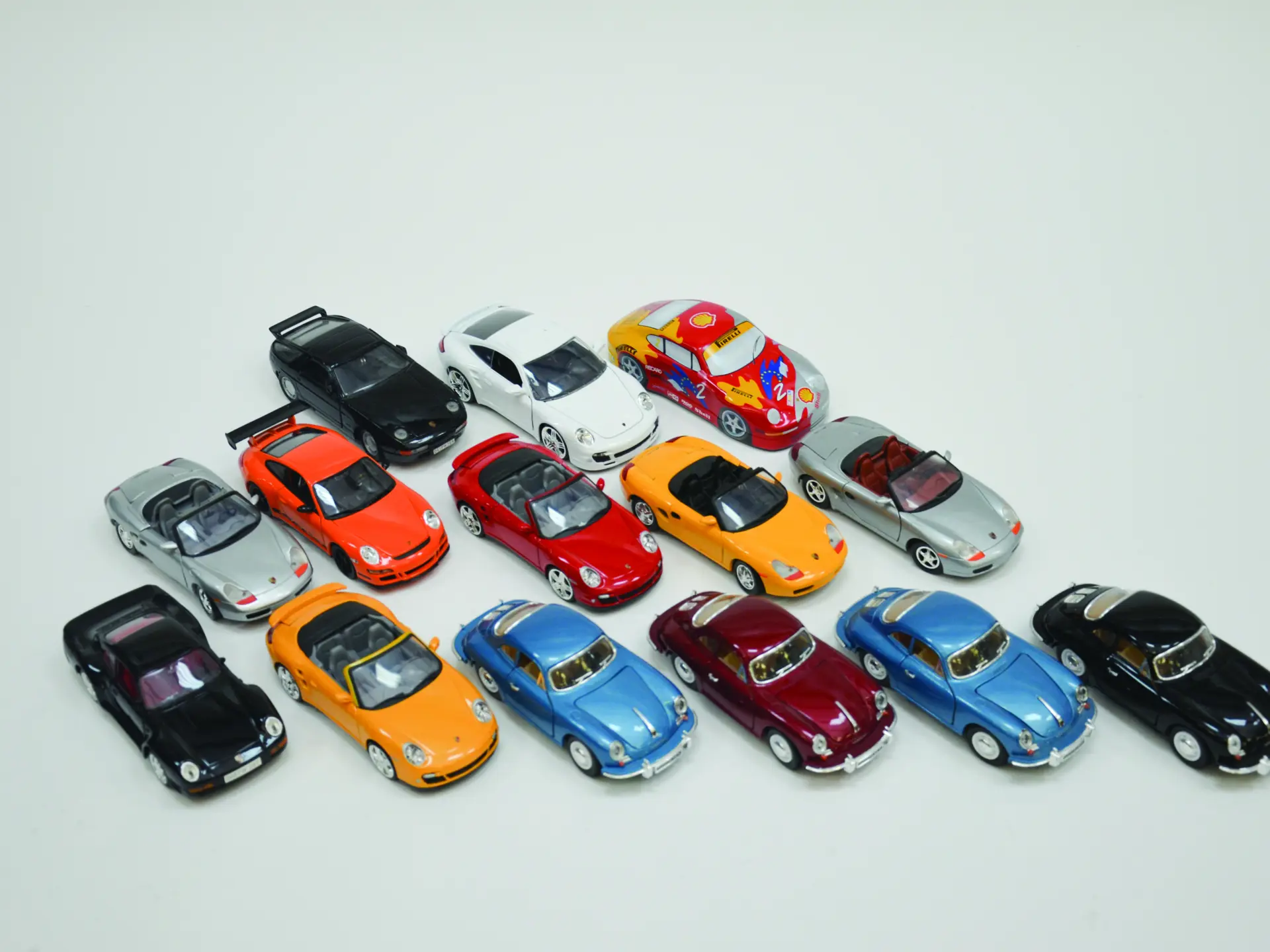 A group of 14 diecast Porsche toy cars 1/24 scale mostly various years ...