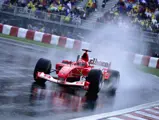 Michael Schumacher drives through the rain on his way to victory at the 2003 Canadian Grand Prix.