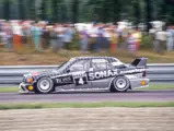 Bernd Schneider flies past the crowd at the Czechoslovakian Brno Circuit on 12 July 1992 while racing in the DTM series. Schneider would set the fastest lap in Race 1.