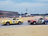 The 2.8 RSR racing past an AMC Gremlin at the 1973 12 Hours of Sebring.