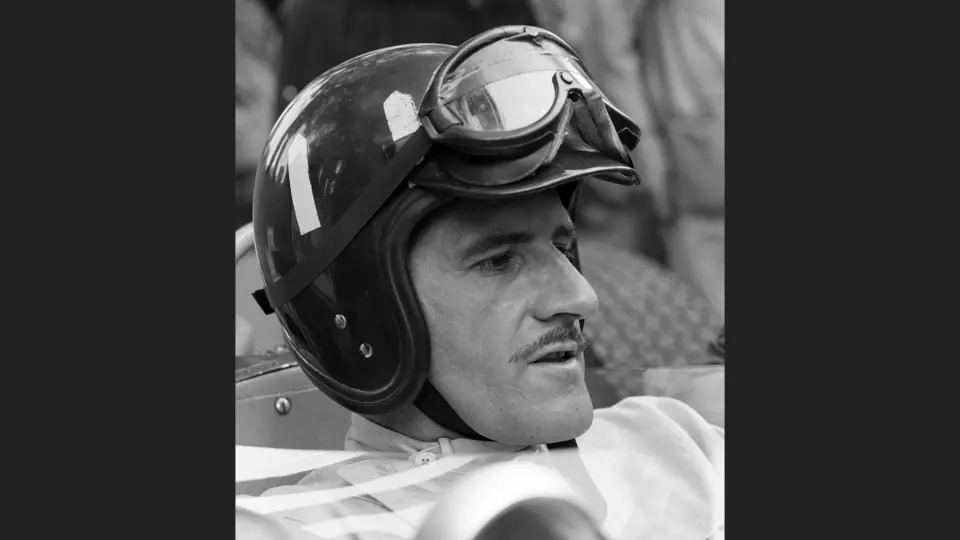 Graham Hill at the 1966 Monaco Grand Prix wearing his racing helmet. He finished in 3rd-place.