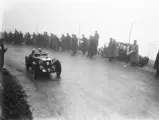 With his wife as co-driver, Eddie Hall competes in the Works-entered MG K3 Magnette at the 1934 Mille Miglia.