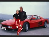 Nigel Mansell is pictured with his Ferrari Testarossa, presented to the driver while racing for Scuderia Ferrari.