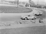 Richie Ginther in chassis no. 550-0089, race #211, chasses down Ken Miles, race #50, at the 1956 Pomono Road Races.