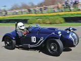 Chassis no. 421/200/210 at speed on the track at the 72nd Goodwood Members meeting. 